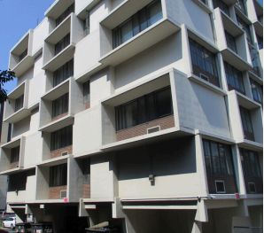 Exterior view of Master Hall, a modernist multi-story residential building at 415 West Gilman Street.